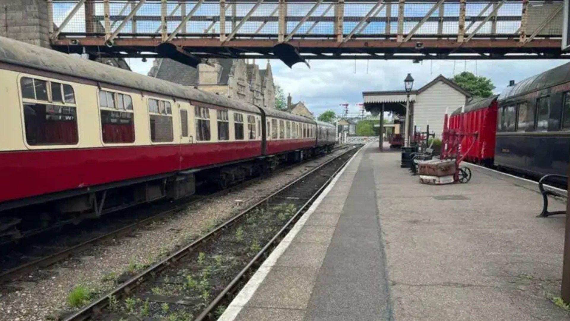 Heritage railway station- with a red and white train on the tracks