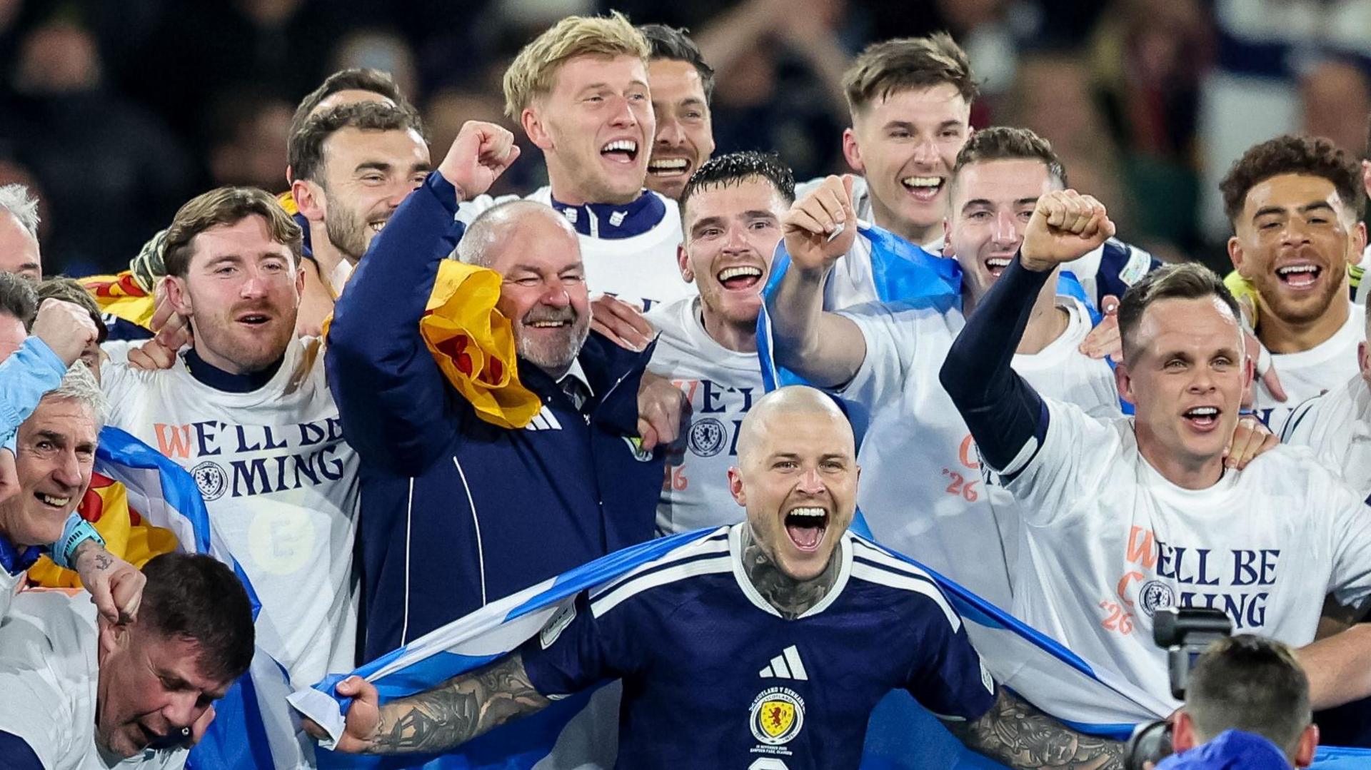 Steve Clarke celebrates with his Scotland players 