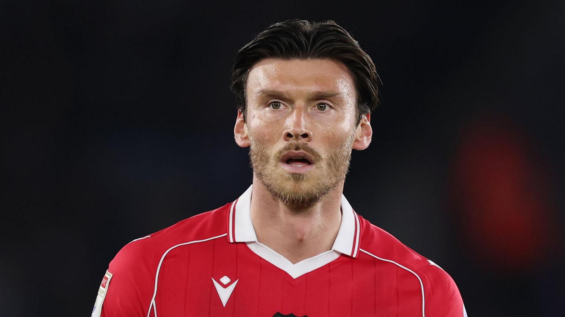 Kieffer Moore looks on during a Wrexham game