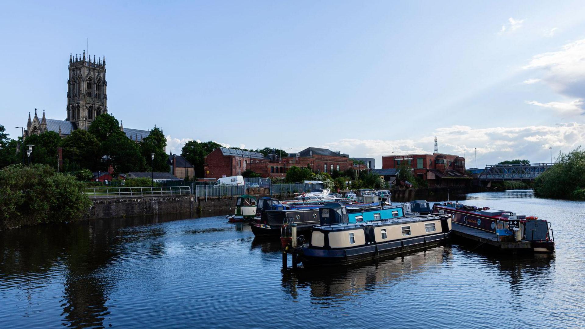 Narrow boats moored in front of Doncaster Minster