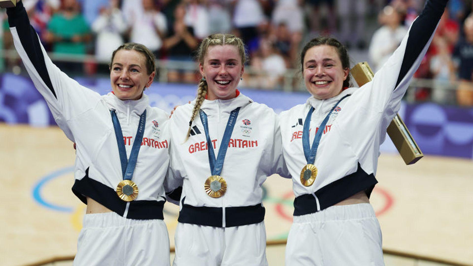 cyclists with gold medal