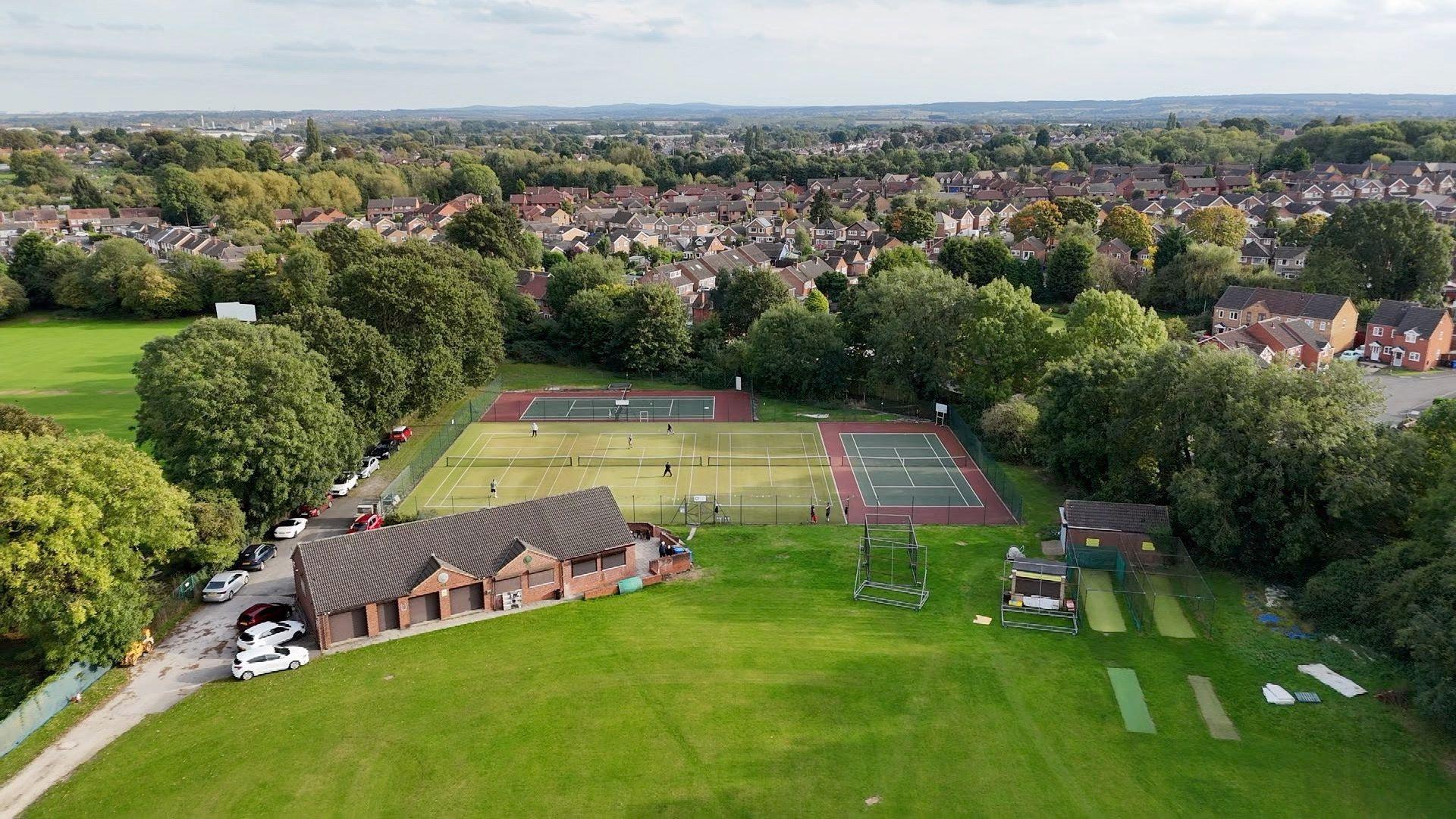 Aerial view of the grounds of the tennis club and cricket club