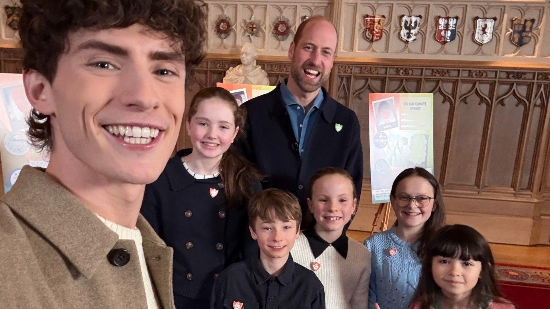 Blue Peter Earthshot competition winners with Blue Peter presenter Joel Mawhinney (left) and Prince William (right). 