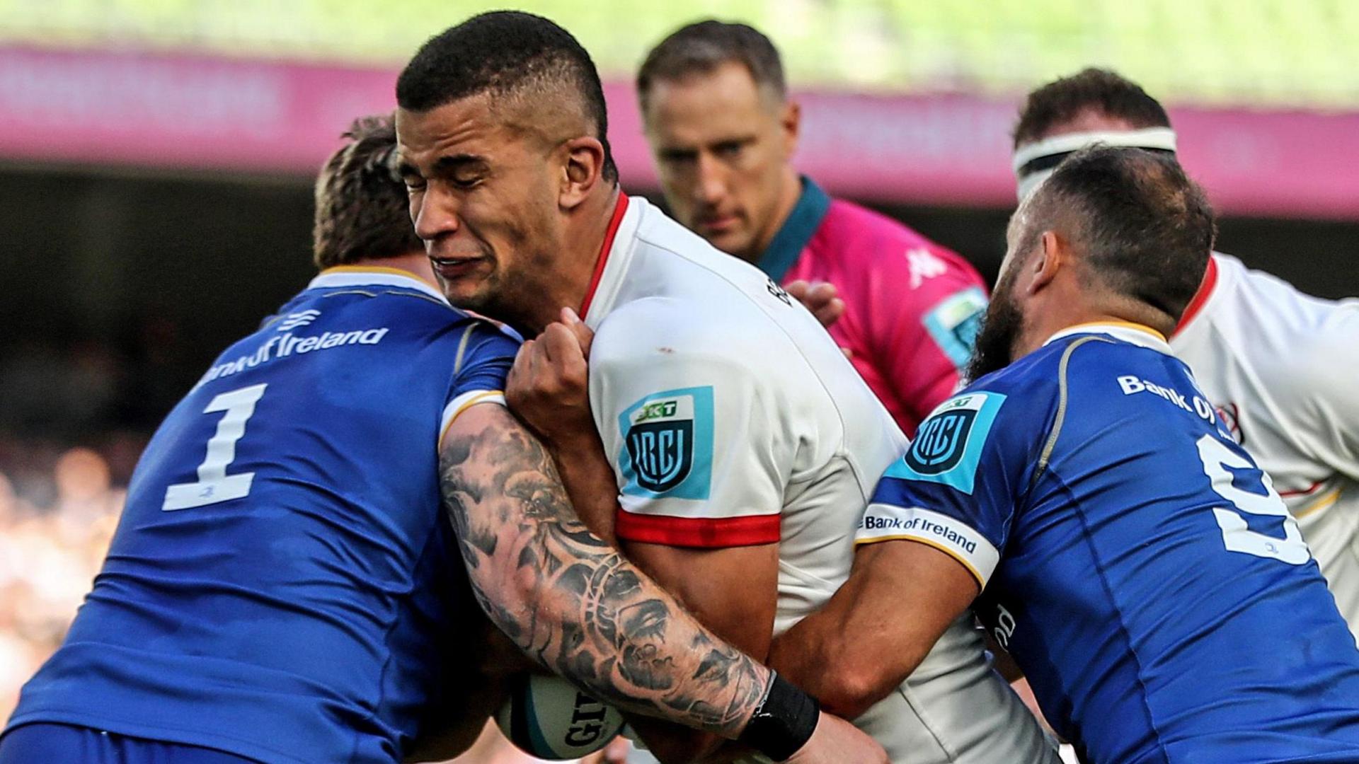 Ulster's Cormac Izuchukwu is tackled by Andrew Porter and Jamison Gibson-Park 