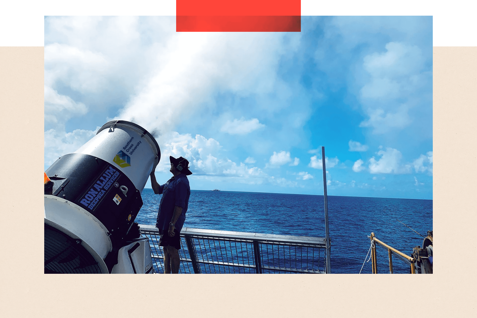 A large cylindrical machine sprays salt water up towards the clouds from a boat