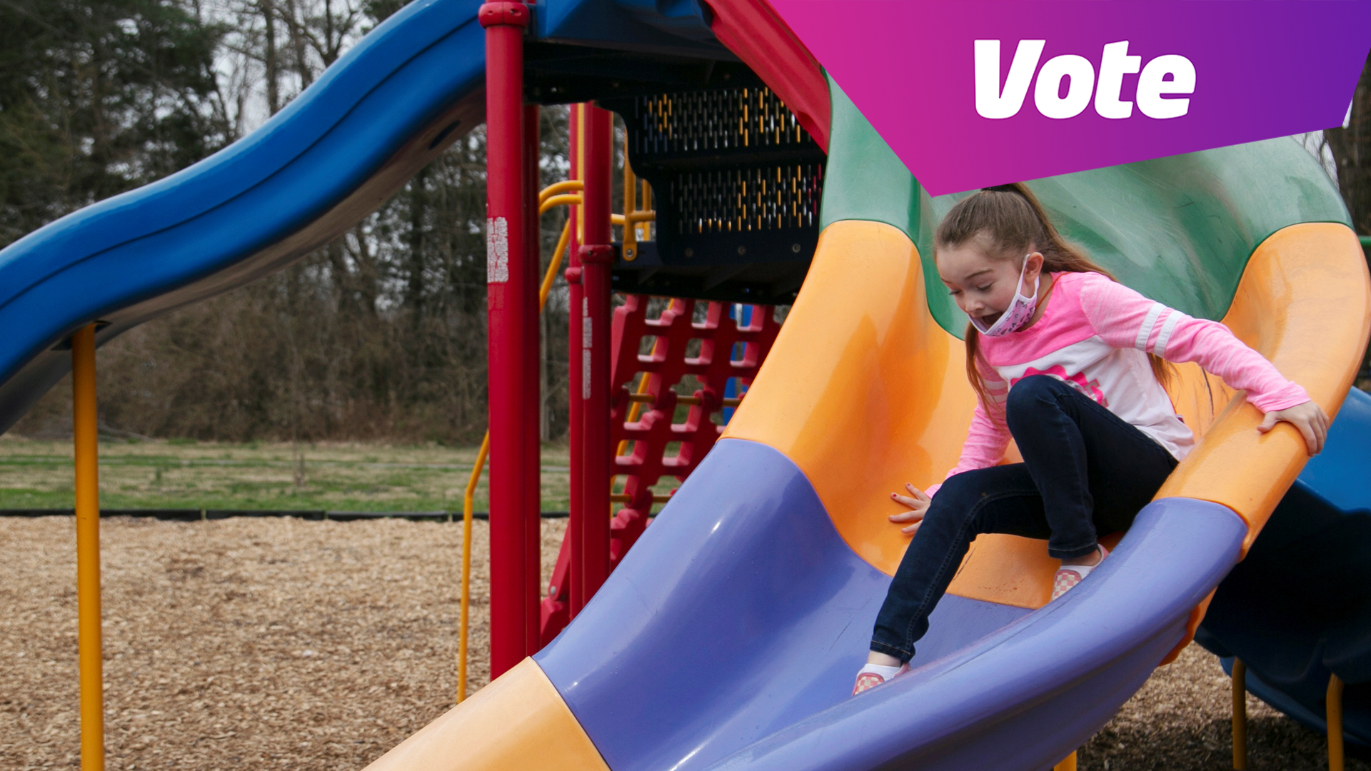 girl going down a slide.