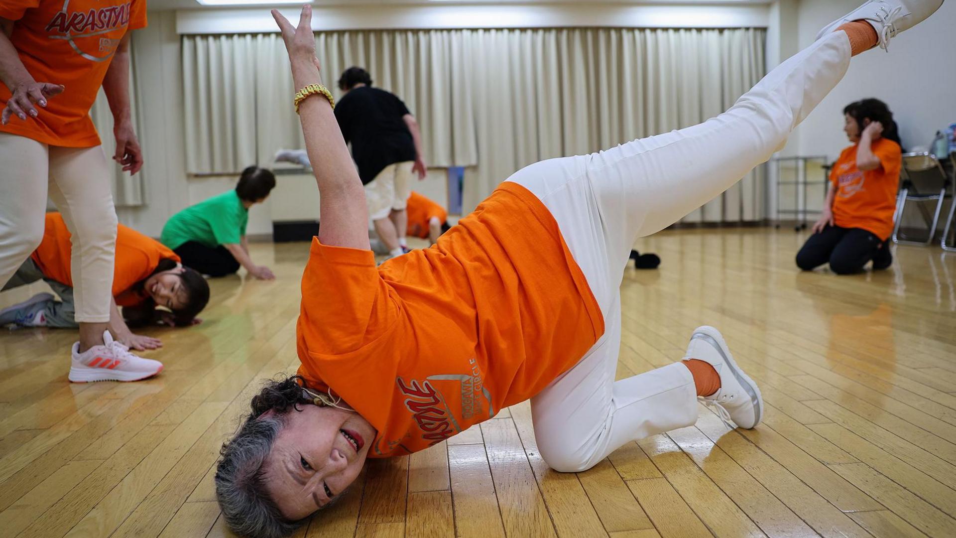 elderly lady, breakdancing pose