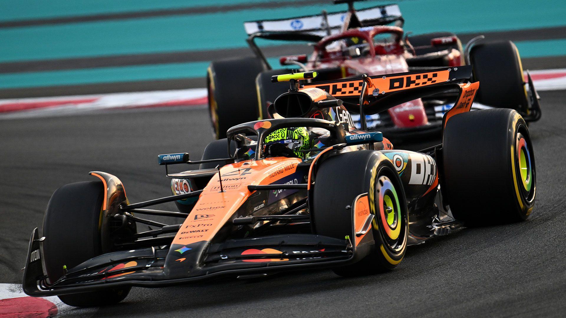 One car ahead of another going round the corner of a track at the F1