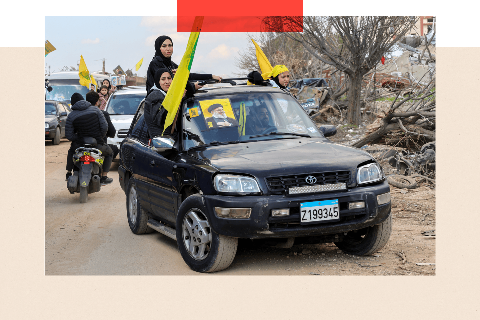 Residents wave Hezbollah flags as they return to their village 