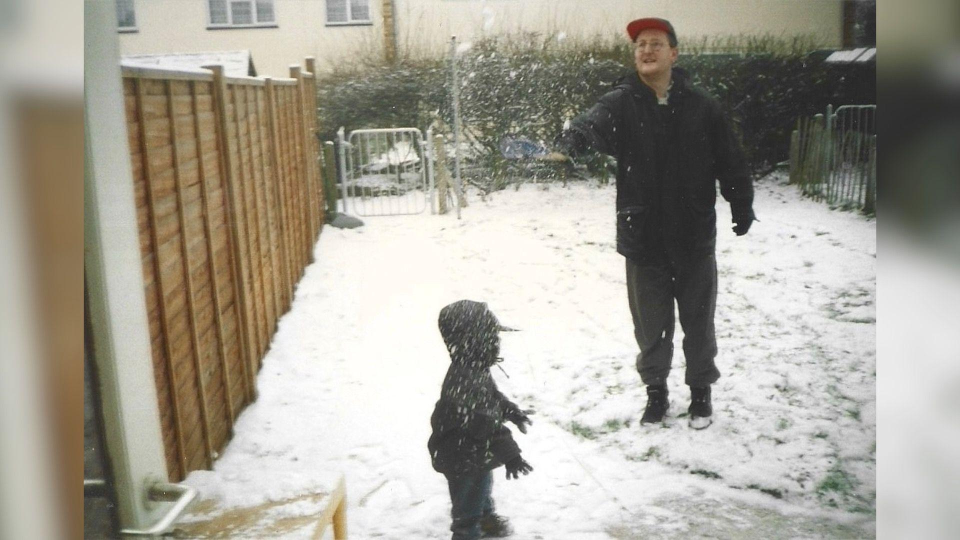 Gavin Usher playing with child