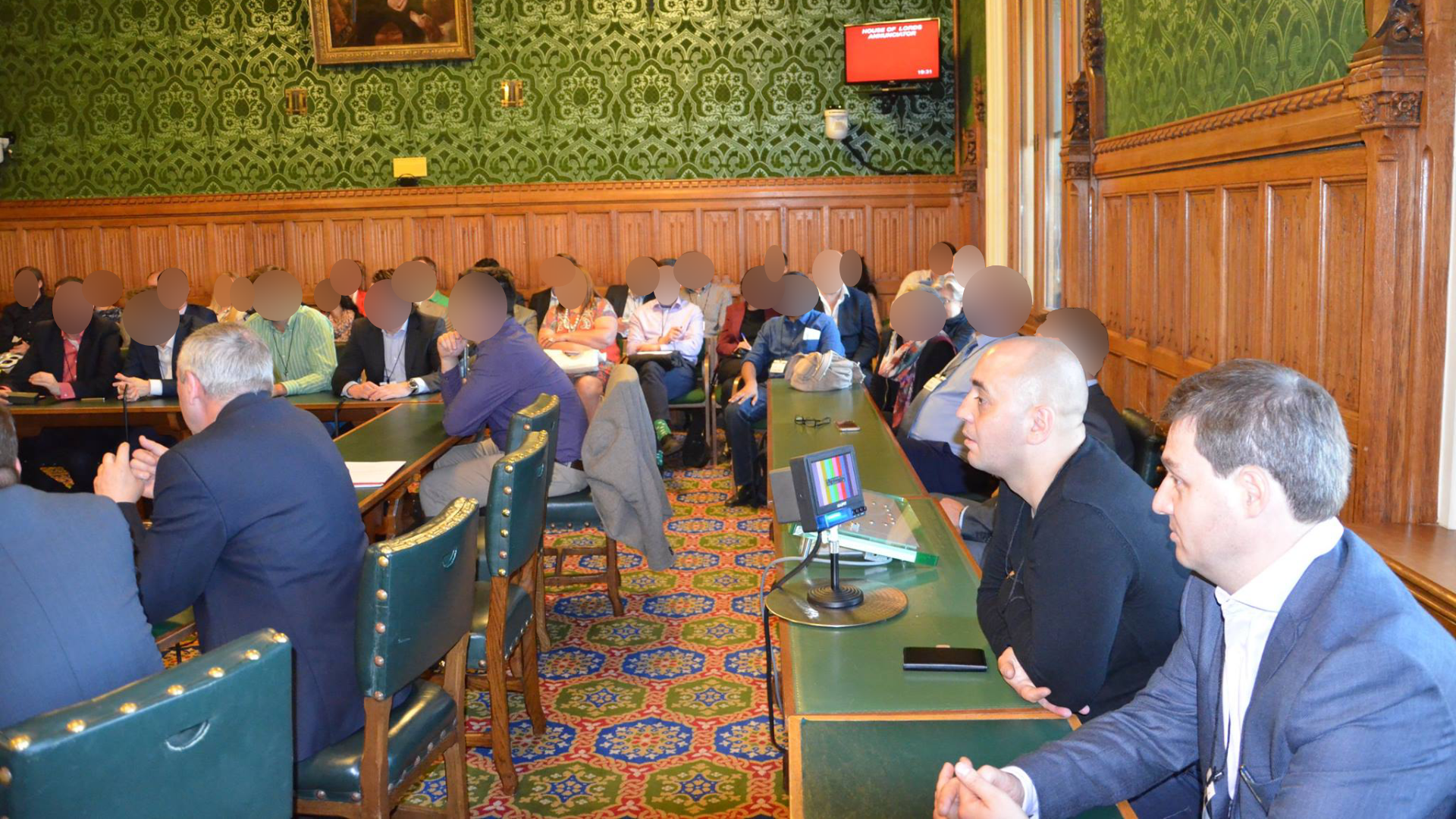 Orlin Roussev, front right, and Biser Dzhambazov, seated next to him, present in Committee Room 6 of the House of Commons