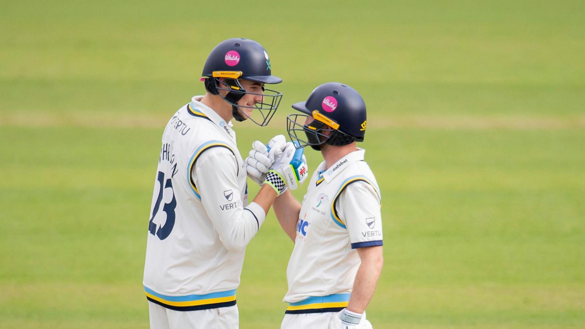 Yorkshire batters James Wharton and Adam Lyth congratulate each other at the crease against Northants