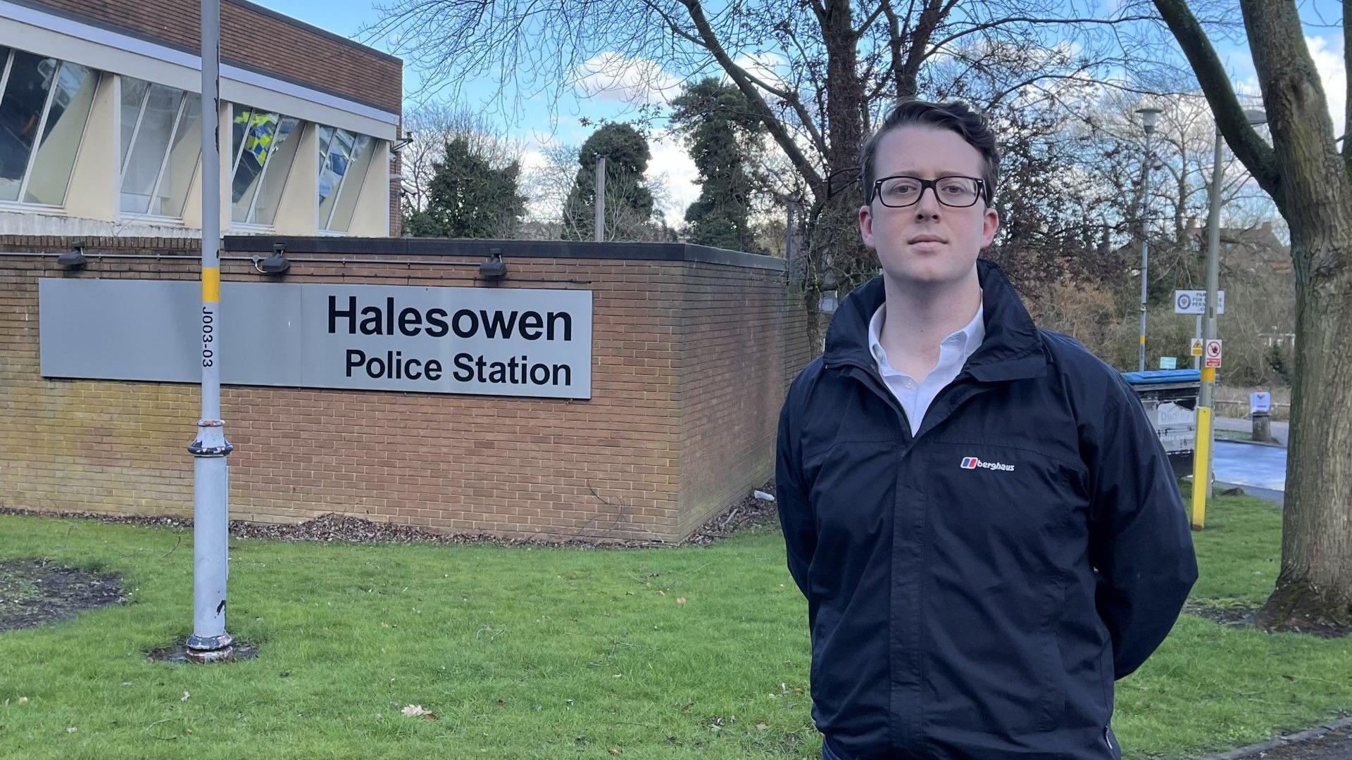 Tom Byrne stood outside a police station