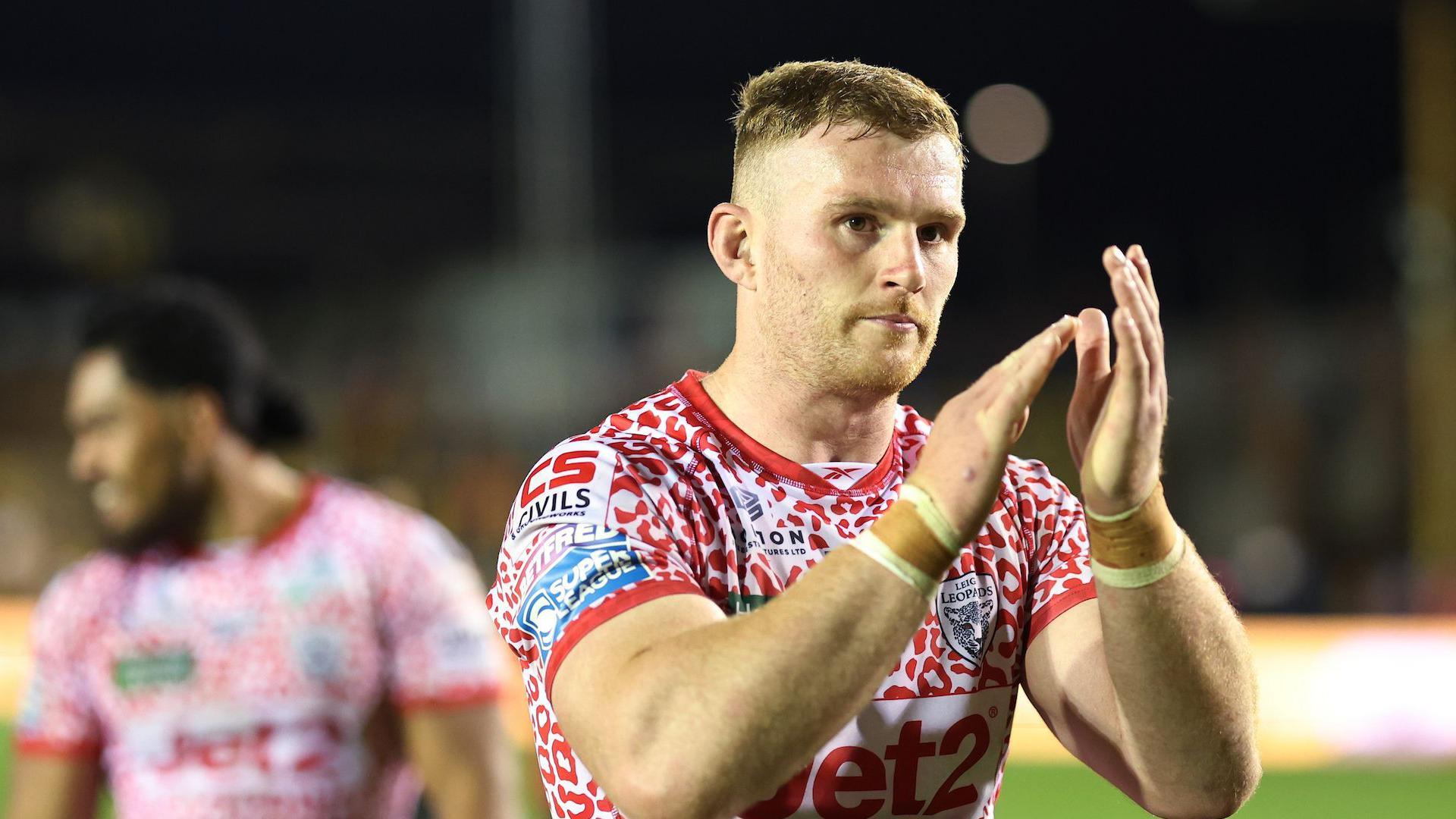 Jack Hughes applauds whilst in action for Leigh Leopards