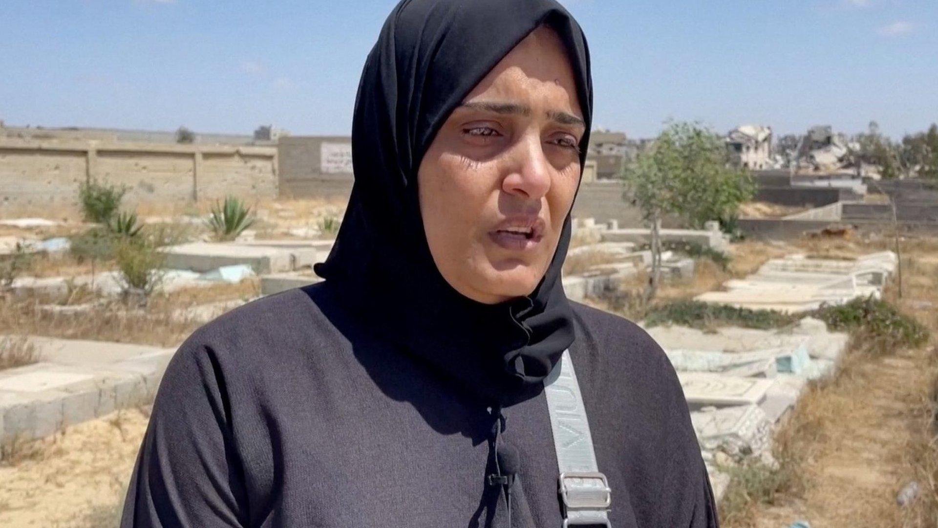 Somaya al-Shourbagy at a cemetery in Khan Younis, in the southern Gaza Strip (24 April 2024)