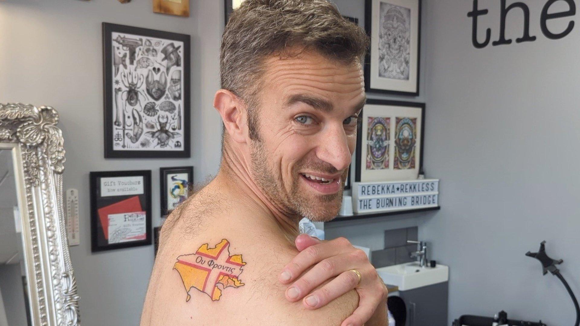 Steve Harris showing his Dorset tattoo on his right shoulder