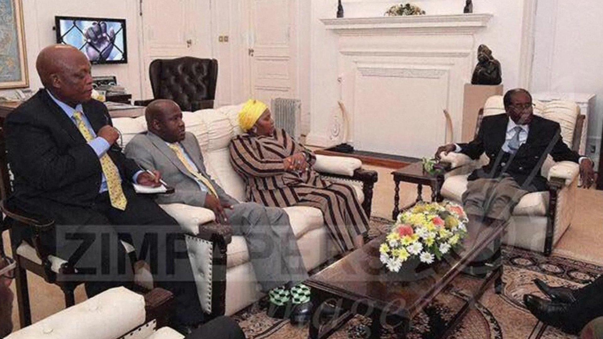 Robert Mugabe (right) with officials at State House on 16 November 2017