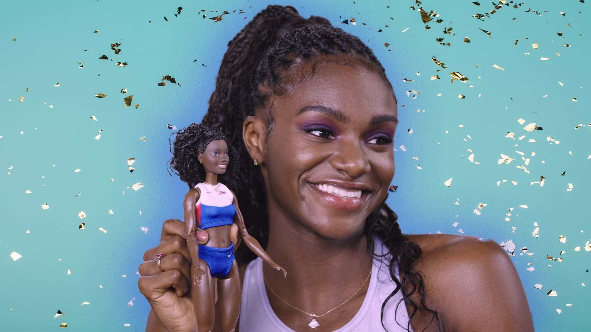 dina-asher-smith-with a-barbie-doll-that-was-made-for-her