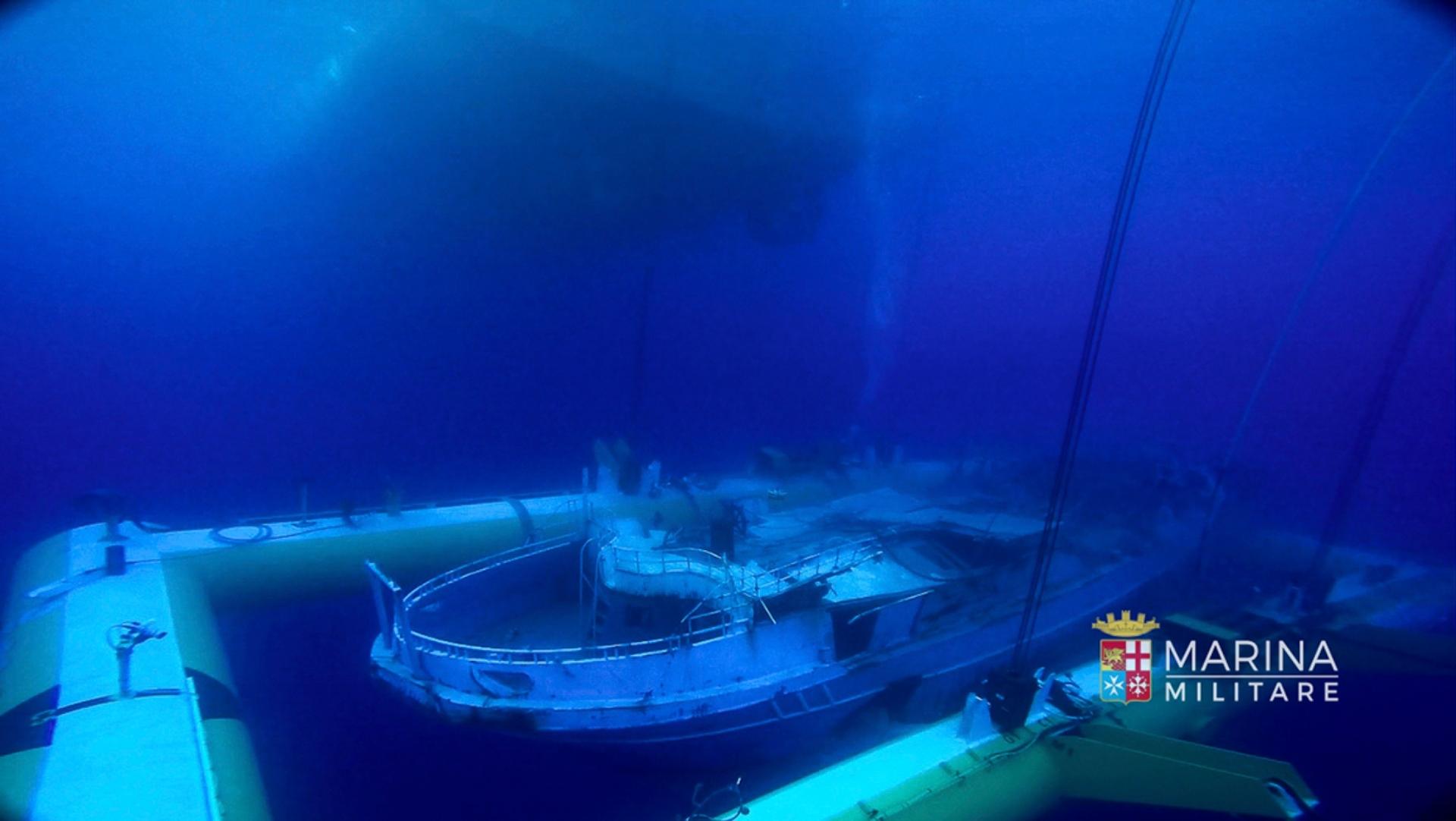 A fishing boat was attached to a cradle in order to lift it from the sea bed