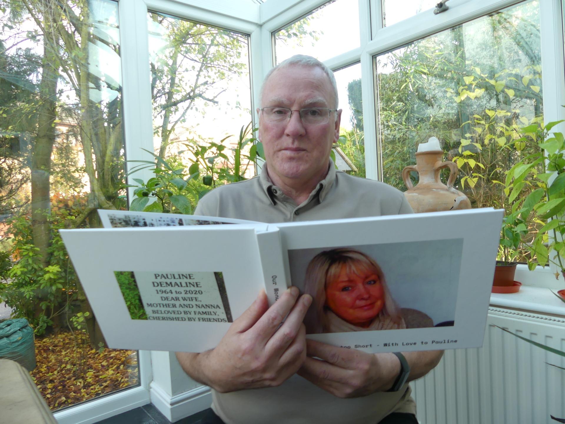 Nigel with the memory book of Pauline