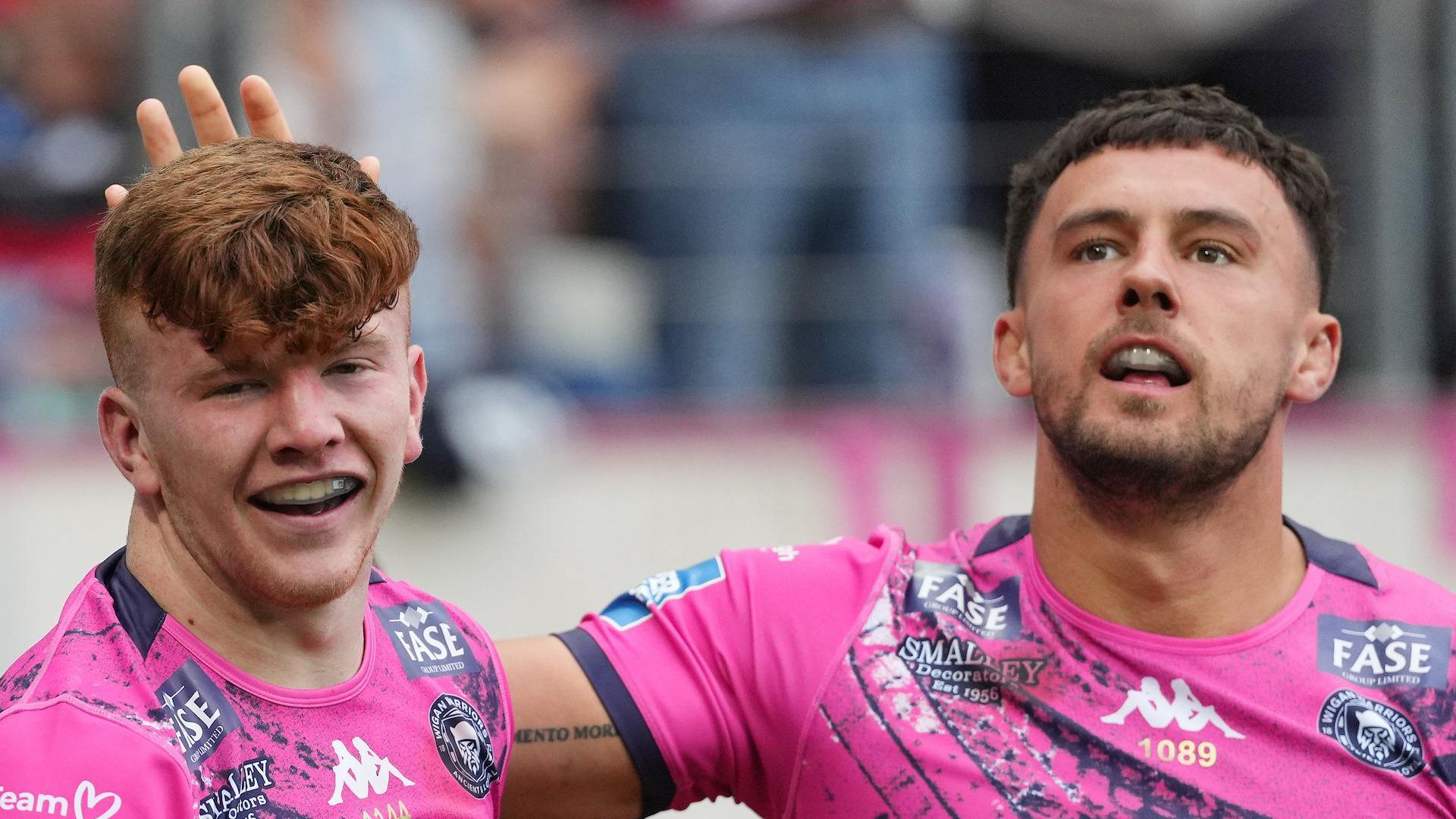 George Marsden (left) celebrates his try for Wigan Warriors against Catalans Dragons