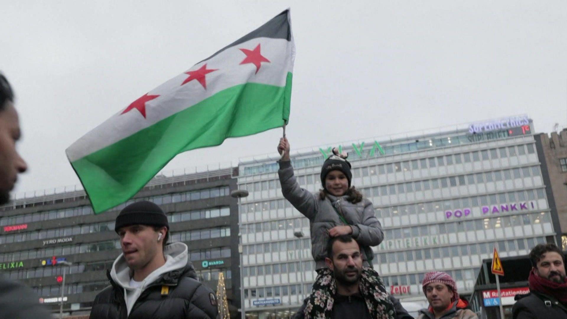 boy waving Syria flag