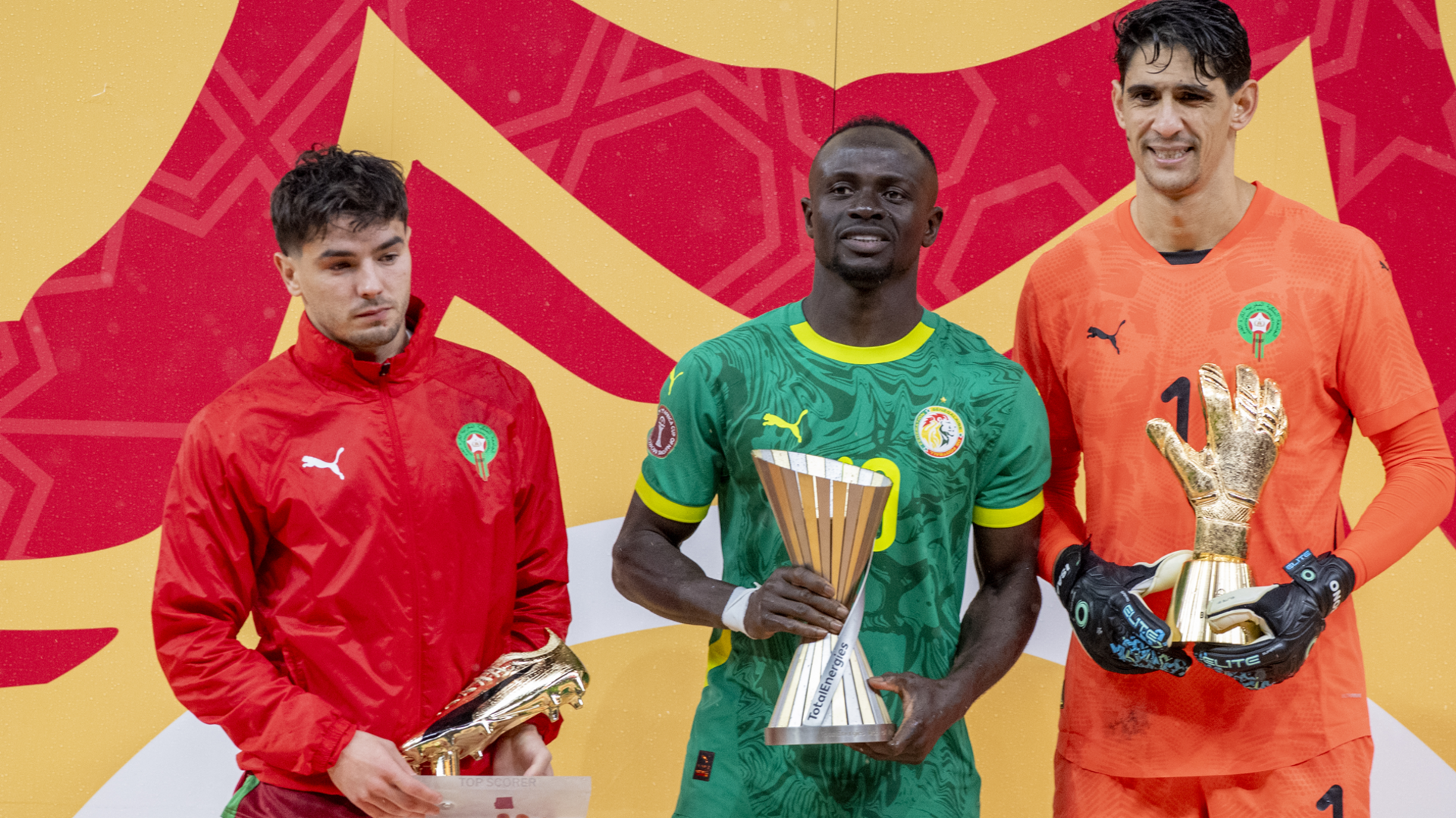 Morocco's Brahim Diaz (L) the tournament's top scorer, Senegal's Sadio Mane (C) the tournament's best player, and Morocco's Yassine Bounou (R) the tournament's best goalkeeper