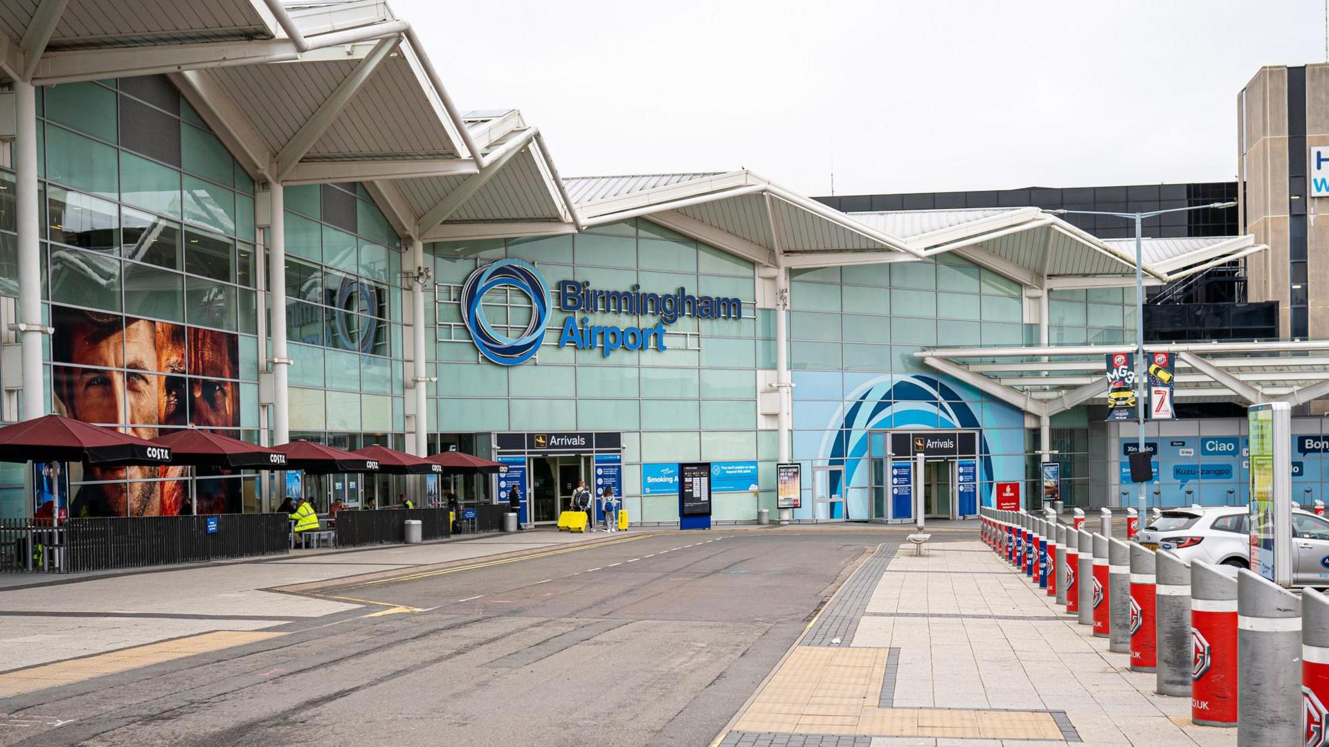 The name sign and facade of Birmingham Airport building. - stock photo