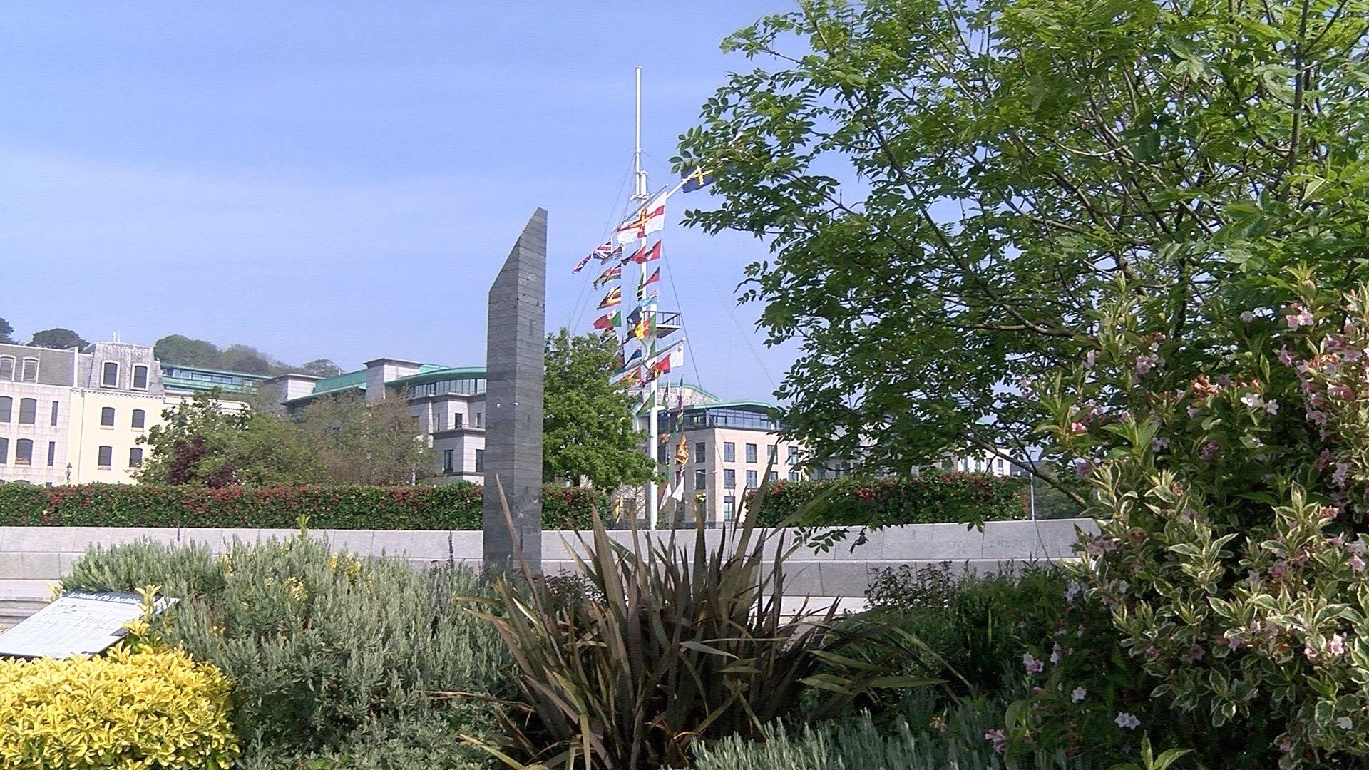 The Liberation Monument with buildings and the memorial mast behind