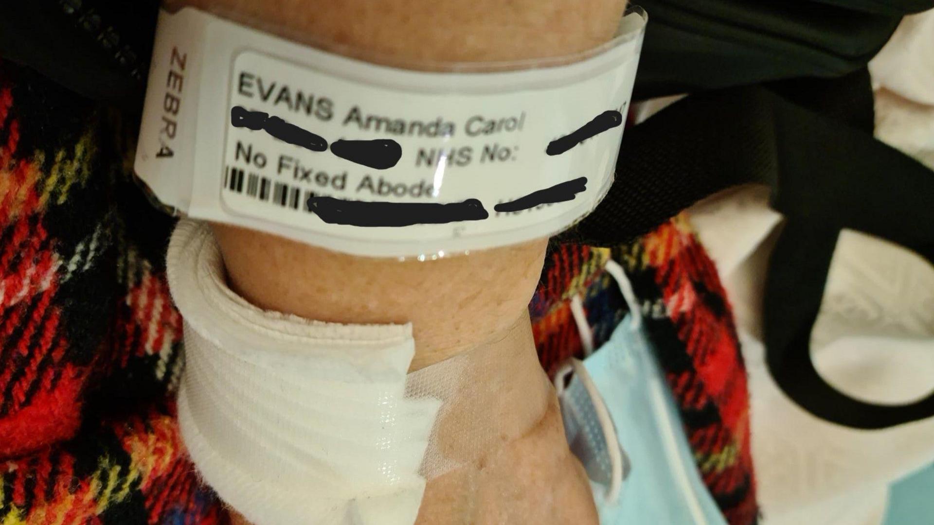 Amanda's hospital bracelet, with "No Fixed Abode" written on the label 