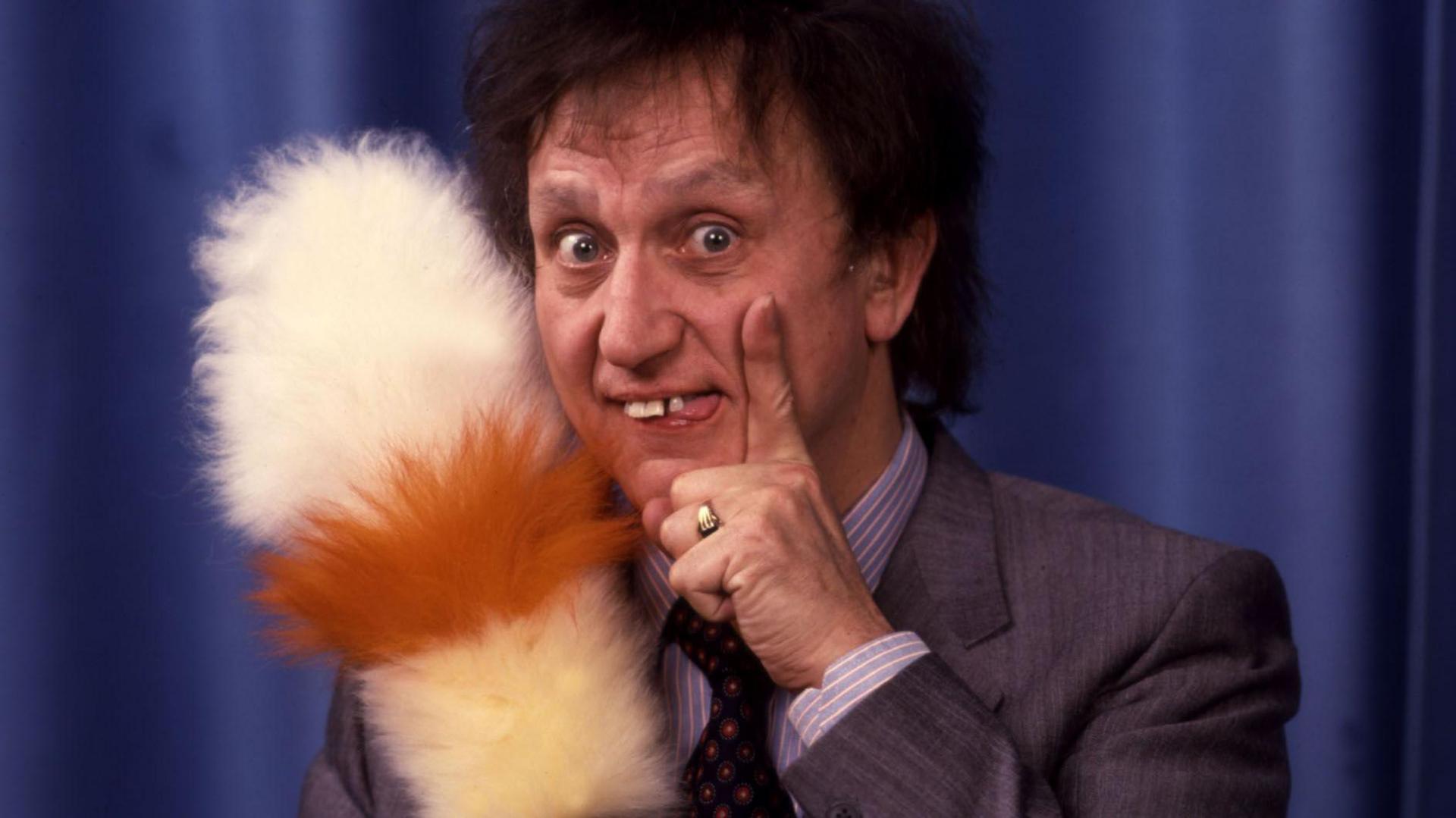 Ken Dodd with tickling stick