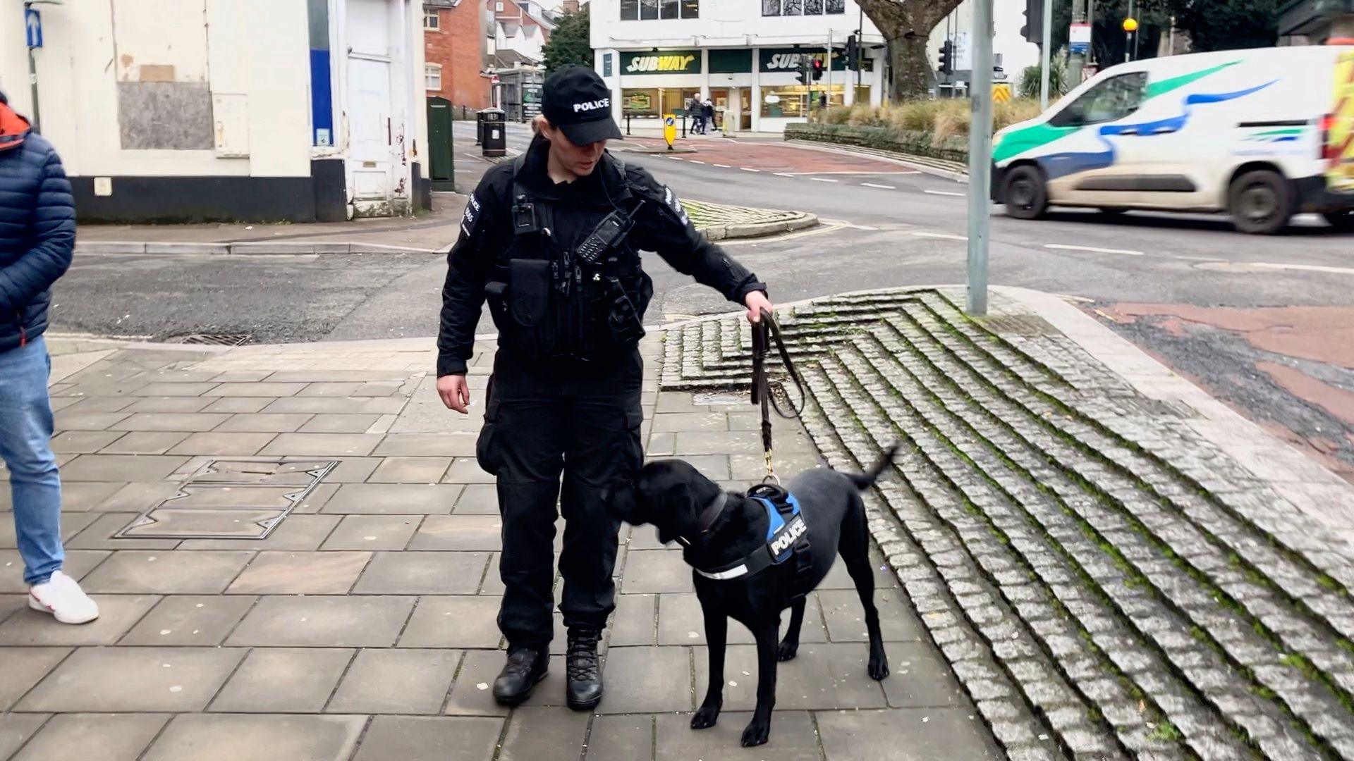 Dog hander PC Sara Fleming out on patrol in Torquay town centre with sniffer dog Ken