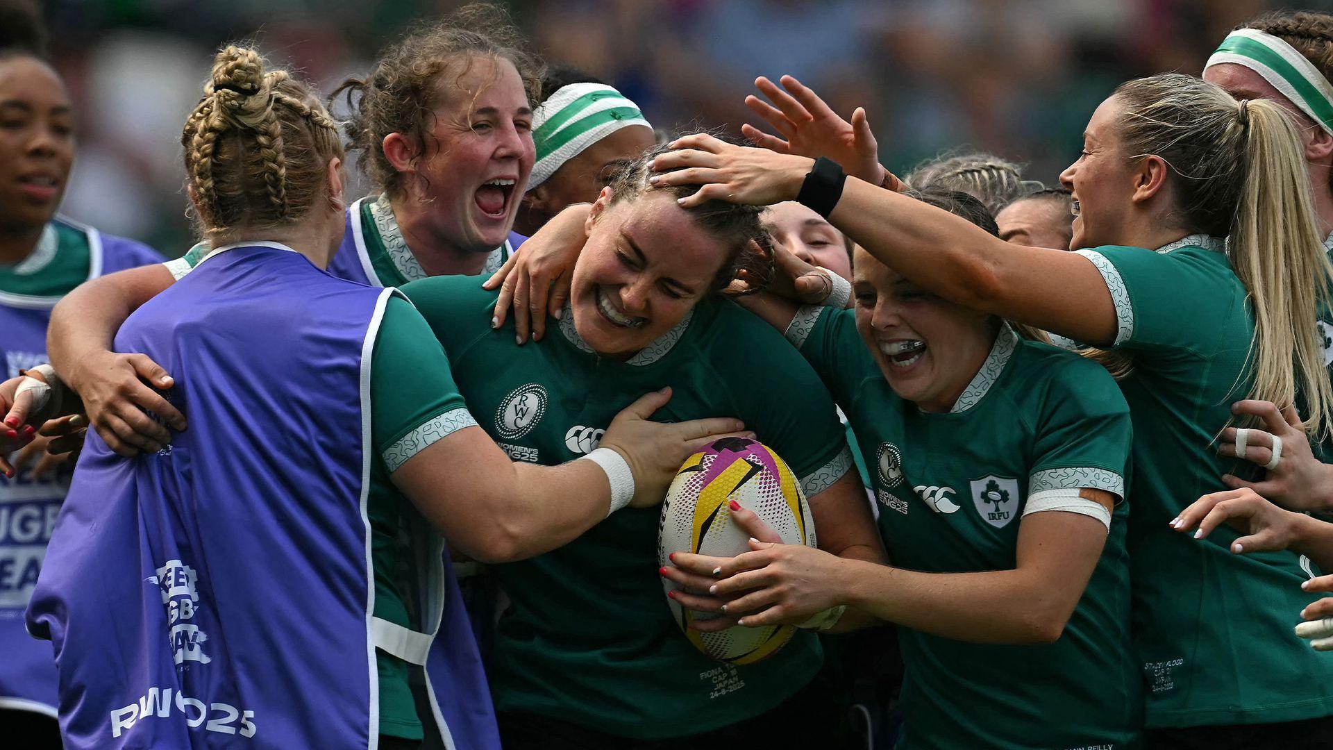 Fiona Tuite celebrates her try with her Ireland team-mates