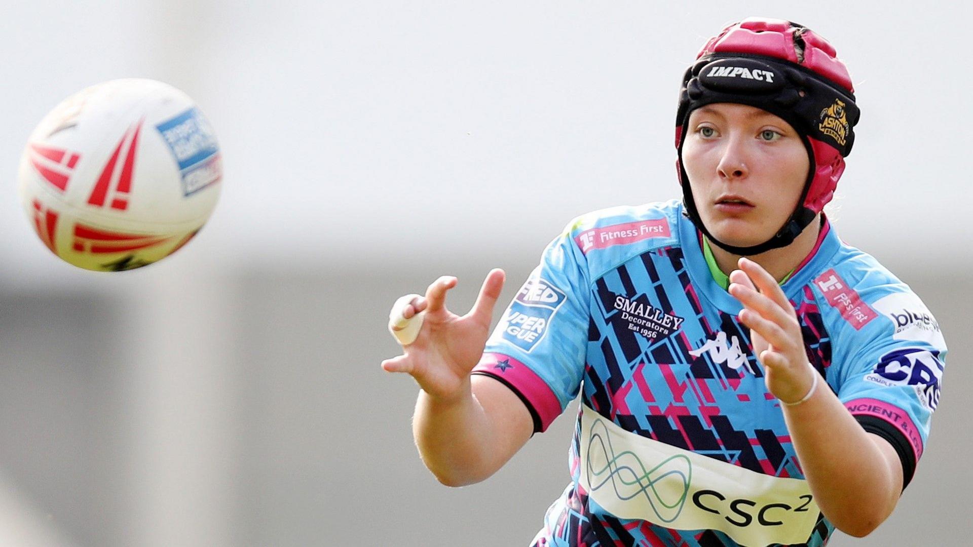 Isabel Rowe catches the ball during a Wigan match