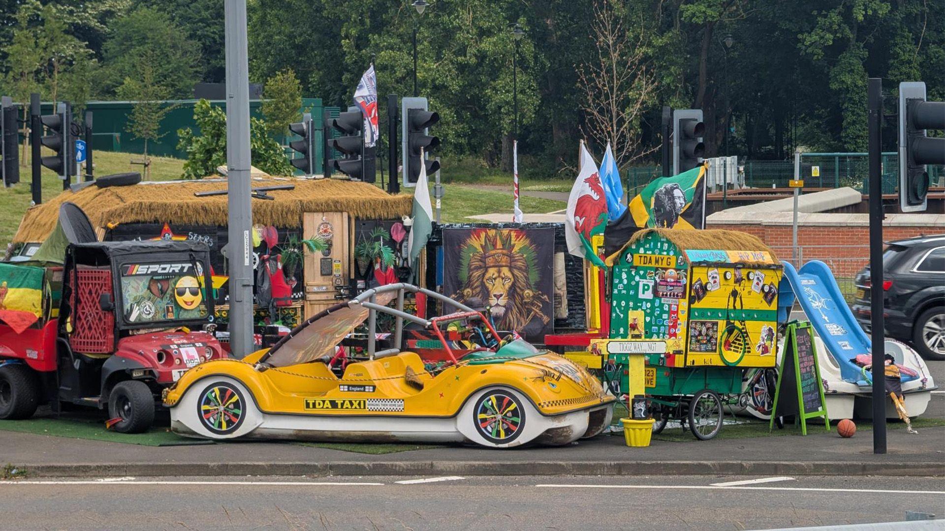 A man living on Cock Pitt island in Derby. Pictured is a bright yellow car, a caravan and blue slide