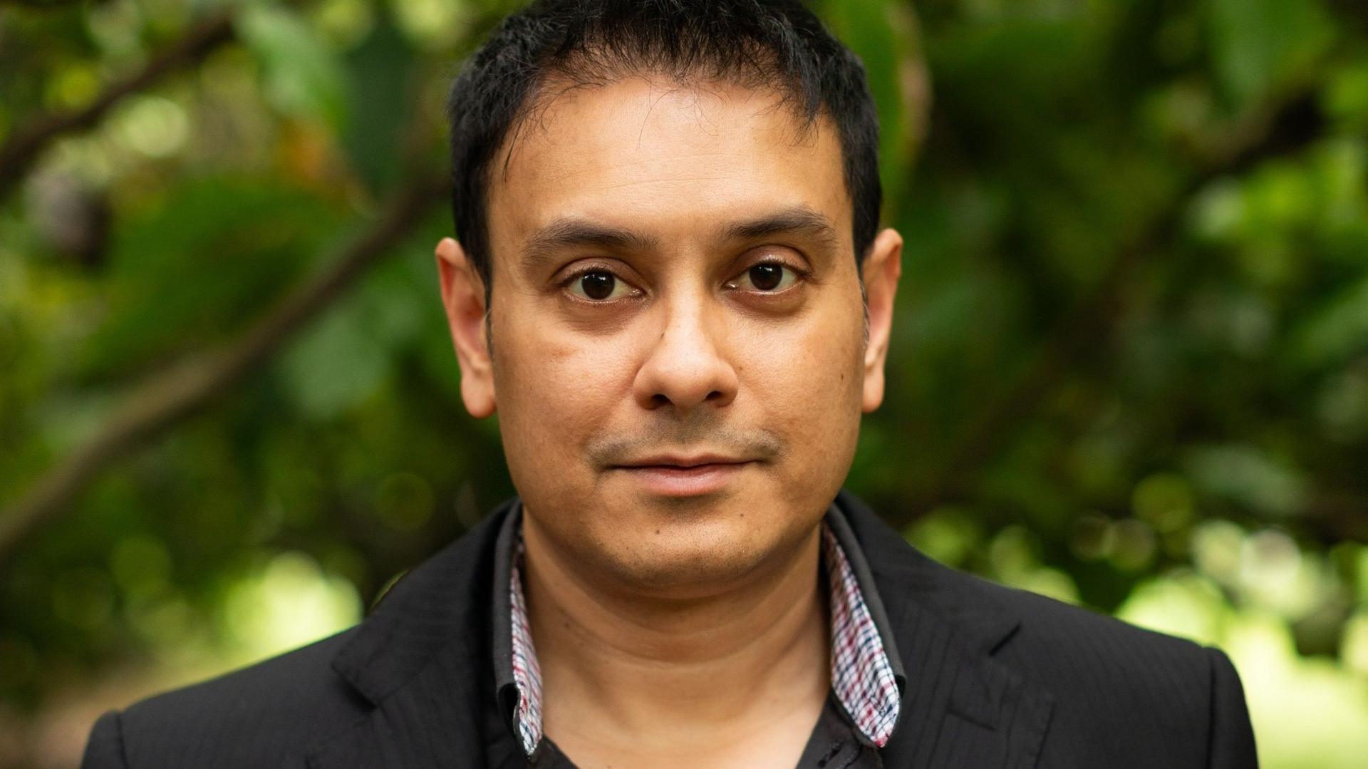 Dr David Gopaulchan facing the camera.