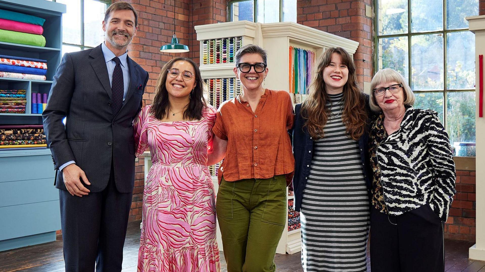 Judges Patrick Grant and Esme Young stand either side of the finalists Yasmin, Caz and Órla.