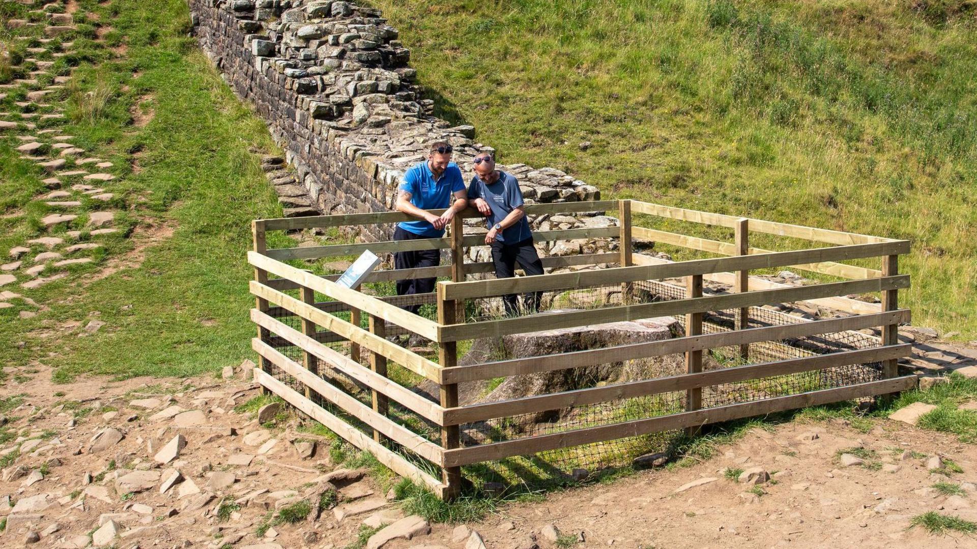 Gary pickles looking at sycamore gap tree stump