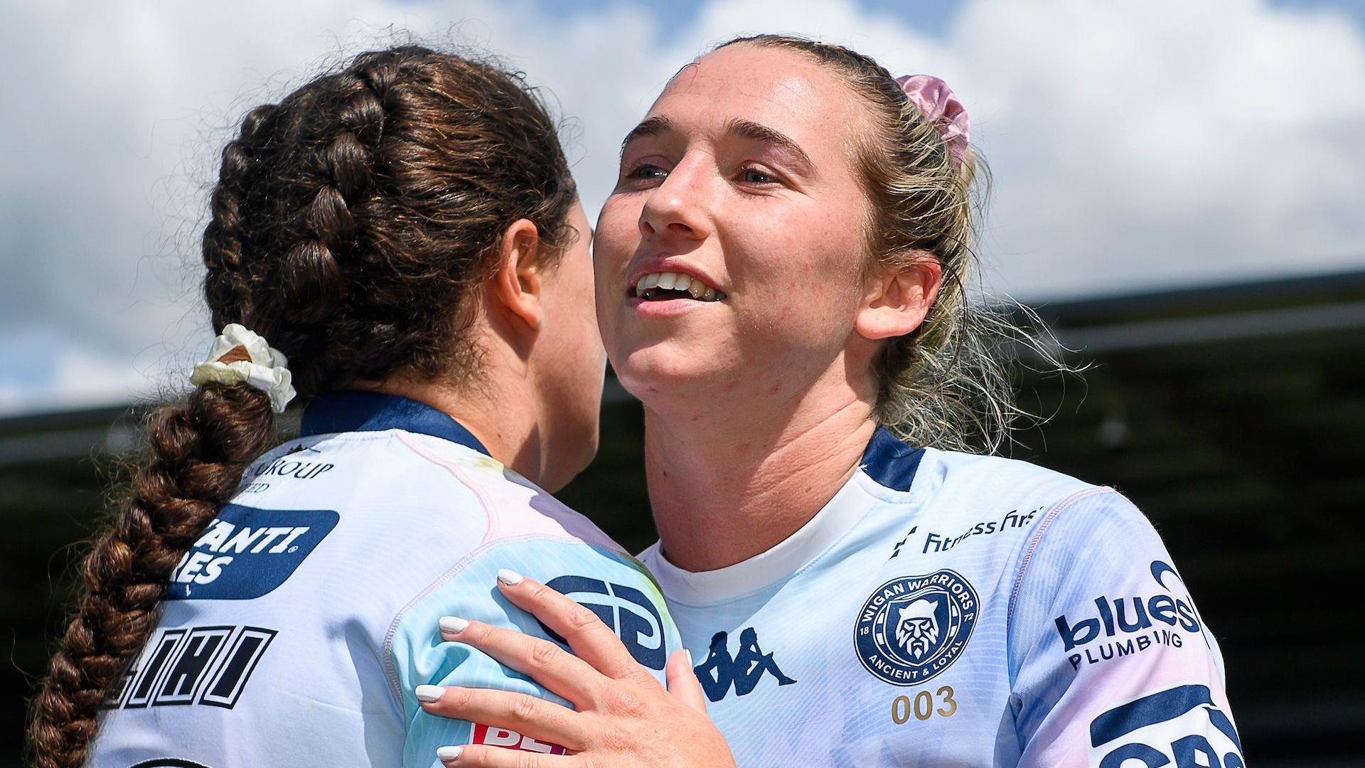 Wigan's Georgia Wilson hugs a team-mate after her side's victory over York.