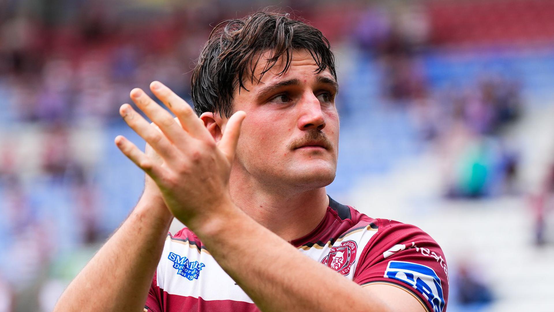 Liam Byrne clapping the Wigan fans at the end of their home match with Wakefield