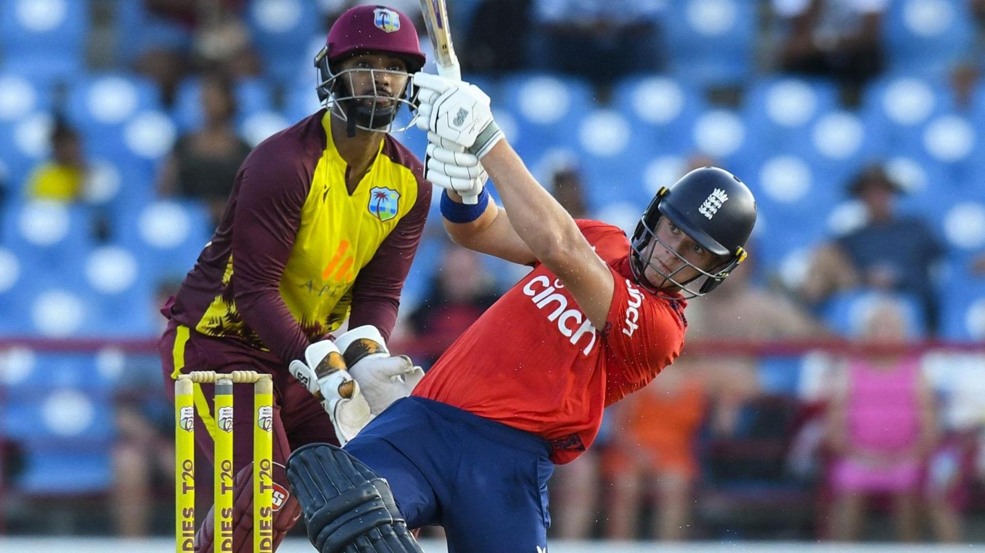 England batter Jacob Bethell plays a shot as West Indies wicketkeeper Nicholas Pooran watches on