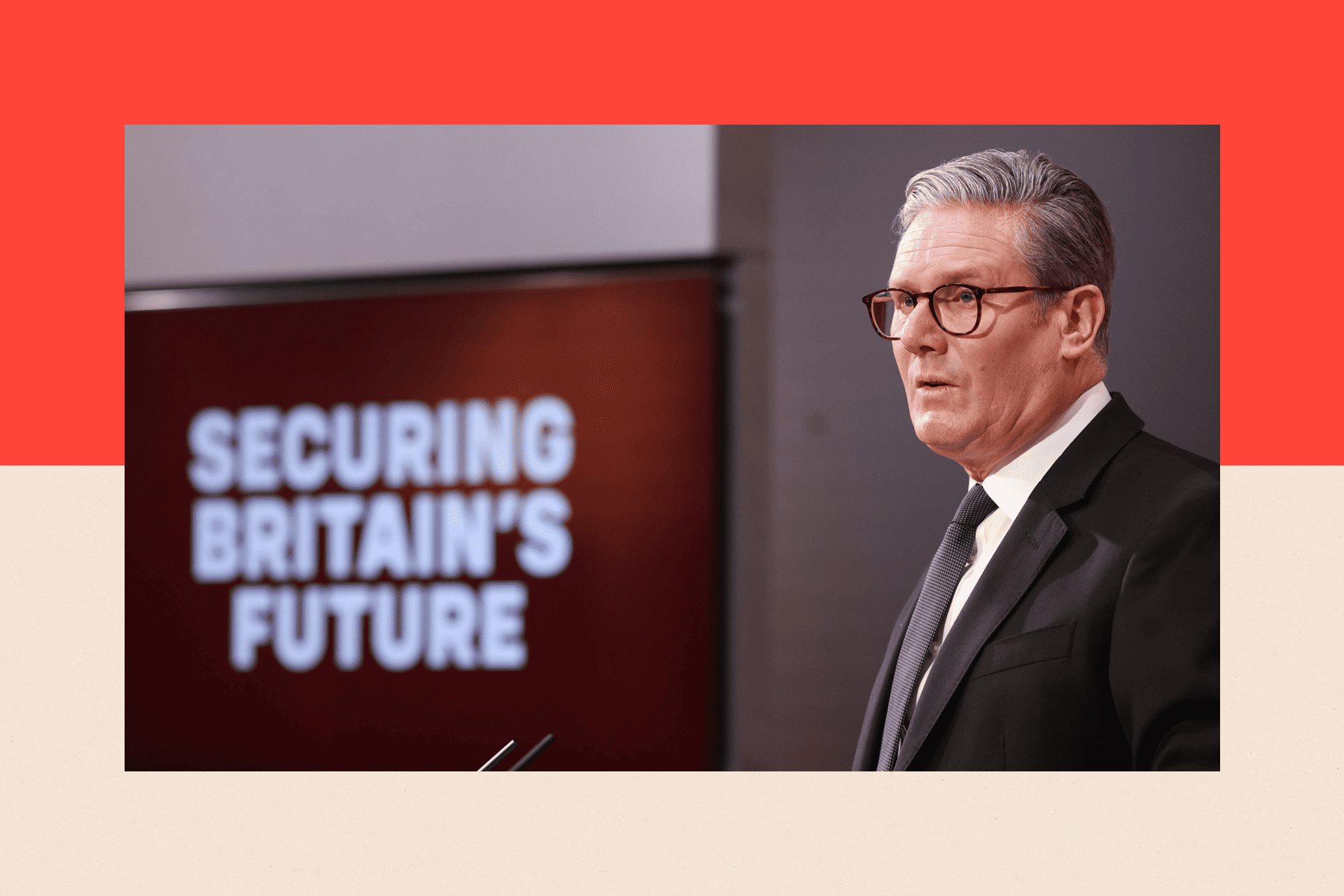 Keir Starmer stands making a speech in front of a screen reading 'Securing Britain's Future'.