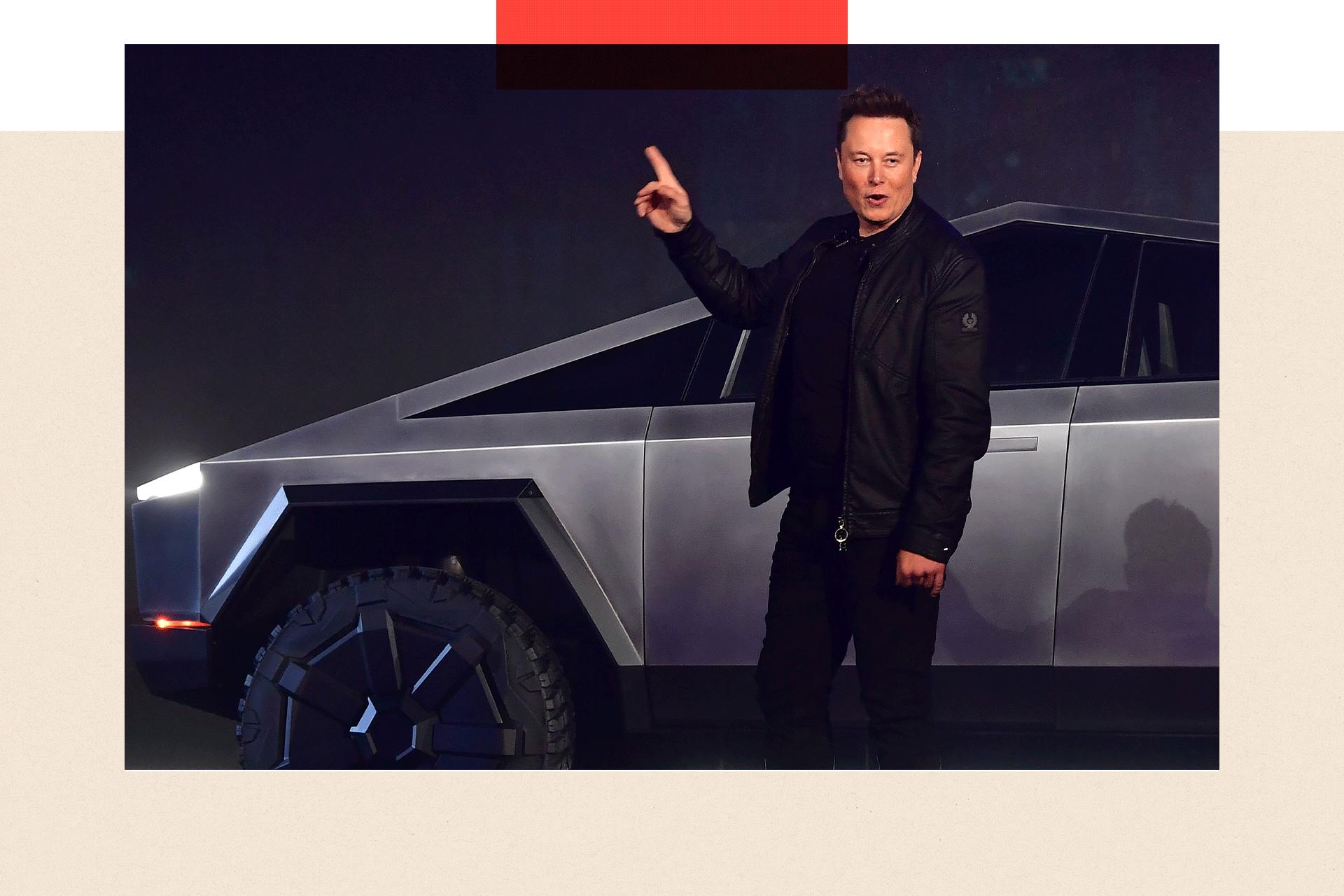 Elon Musk standing next to a Tesla Cybertruck