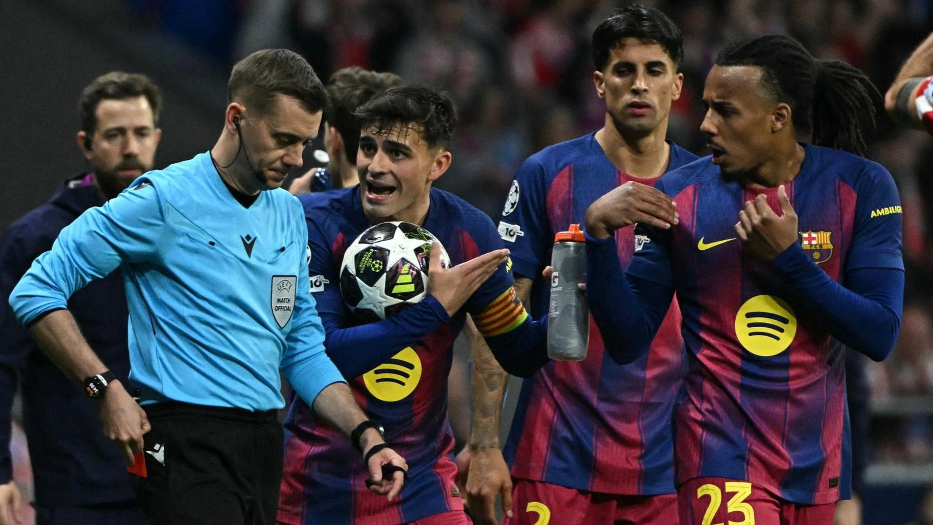 Barcelona players with referee Clement Turpin during the second leg of their Champions League quarter-final against Atletico Madrid