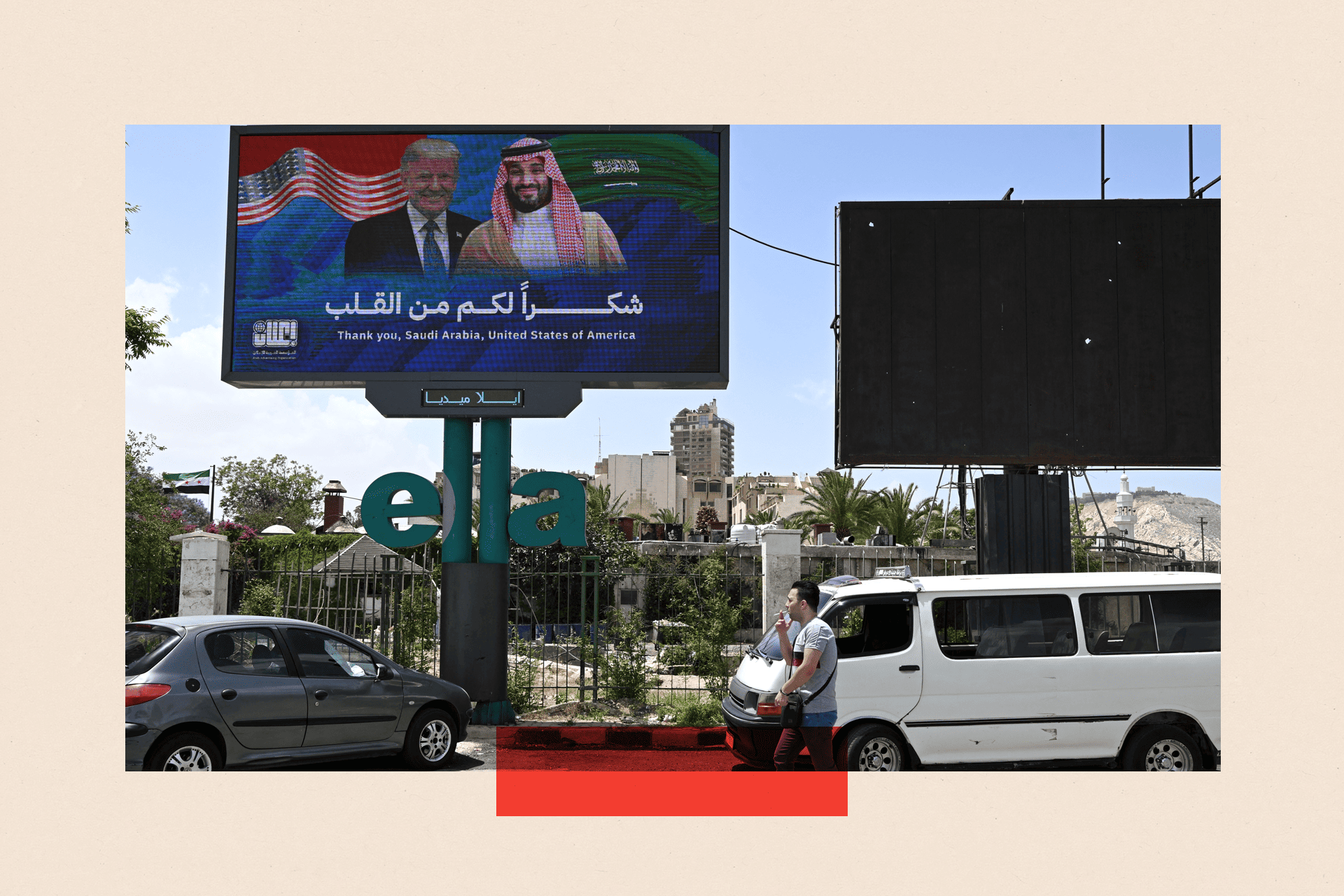 A man walks past a billboard displaying portraits of Saudi Crown Prince Mohammed bin Salman and Donald Trump with a message thanking Saudi Arabia and the United States in Damascus on 14 May 2025