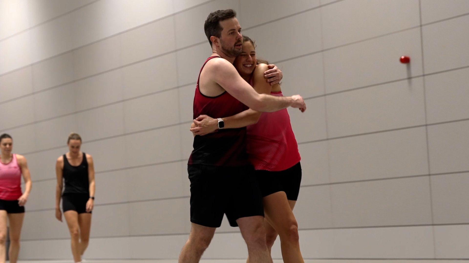 James Thomson-Boston hugs a London Pulse training partner