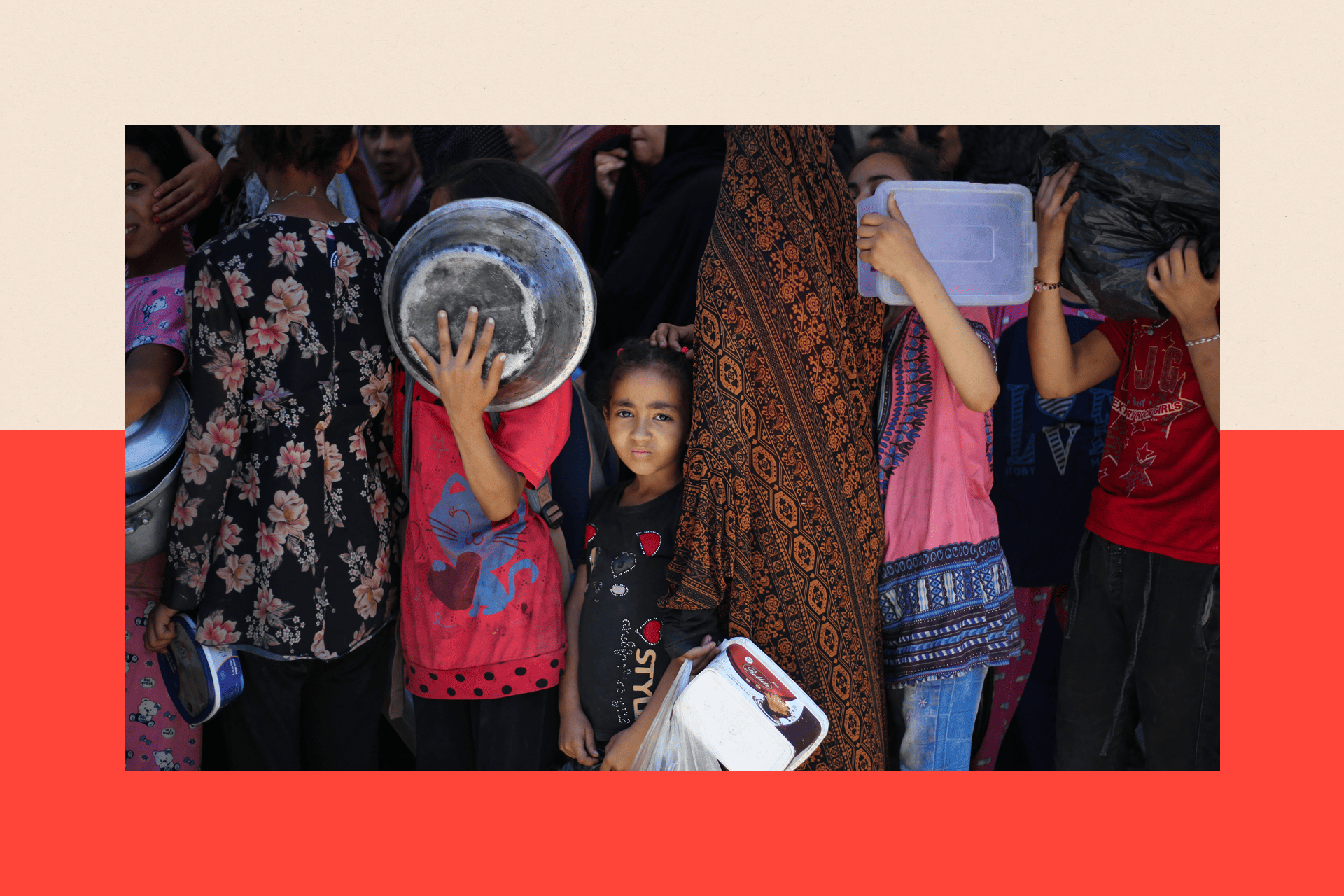 Children and adults queue with bowls