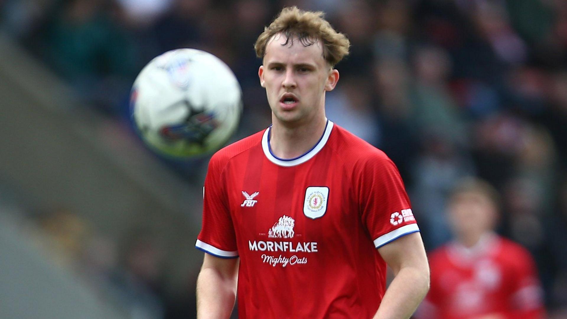 Zac Williams watches the ball carefully during a game for Crewe