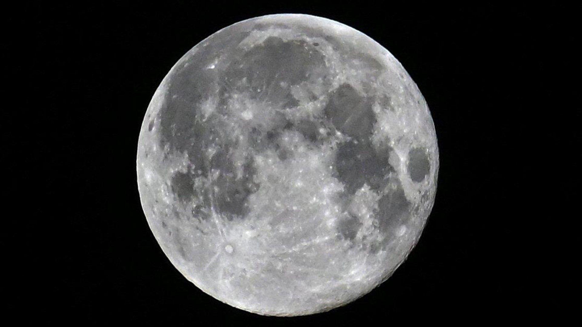 Close up of full moon showing lots of topographic detail