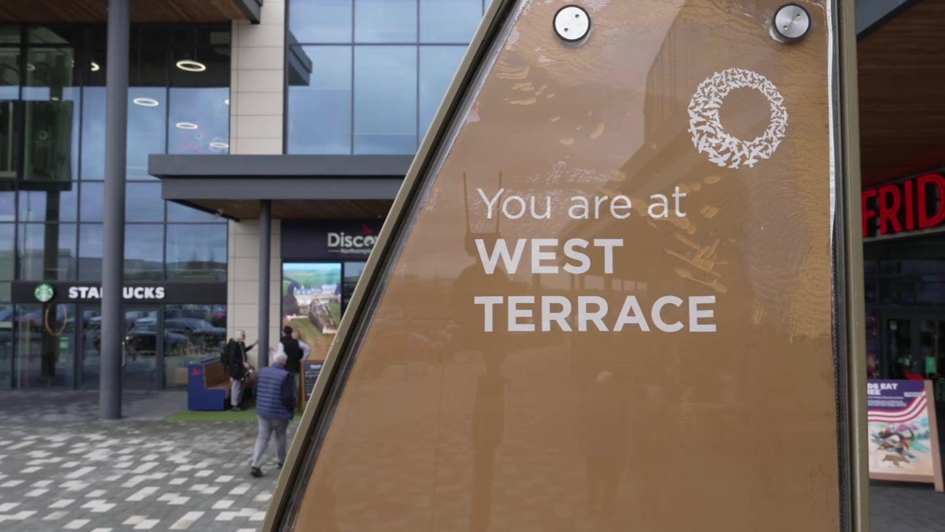 A close up of the West Terrace sign at Rushden Lakes where the businesses used to be based. 